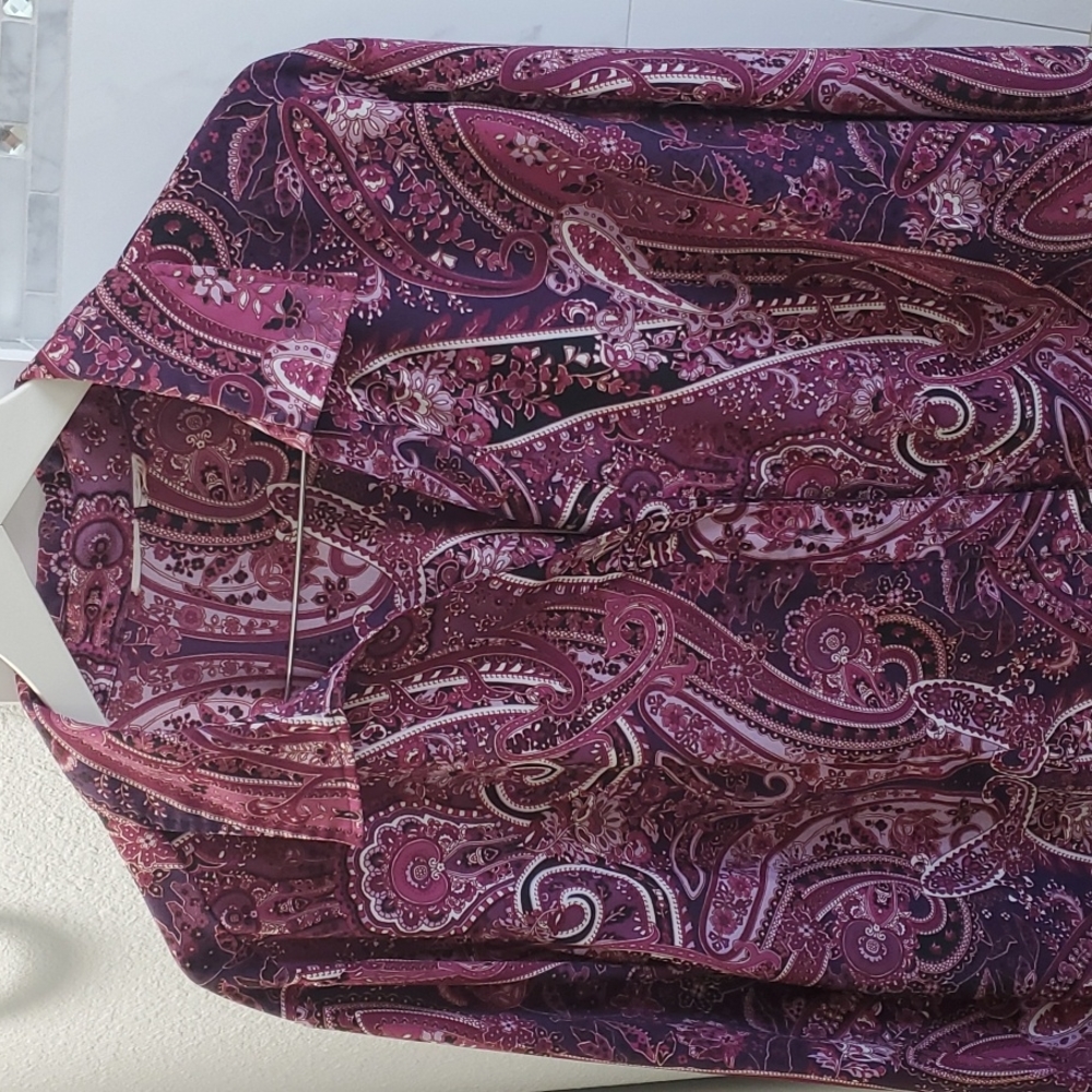 Size 3X Quarter Length Sleeves. I believe it's 100% Polyester.  12$